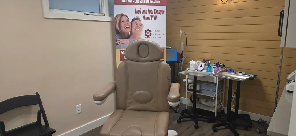 An aesthetic treatment chair and supply cart in a private treatment room